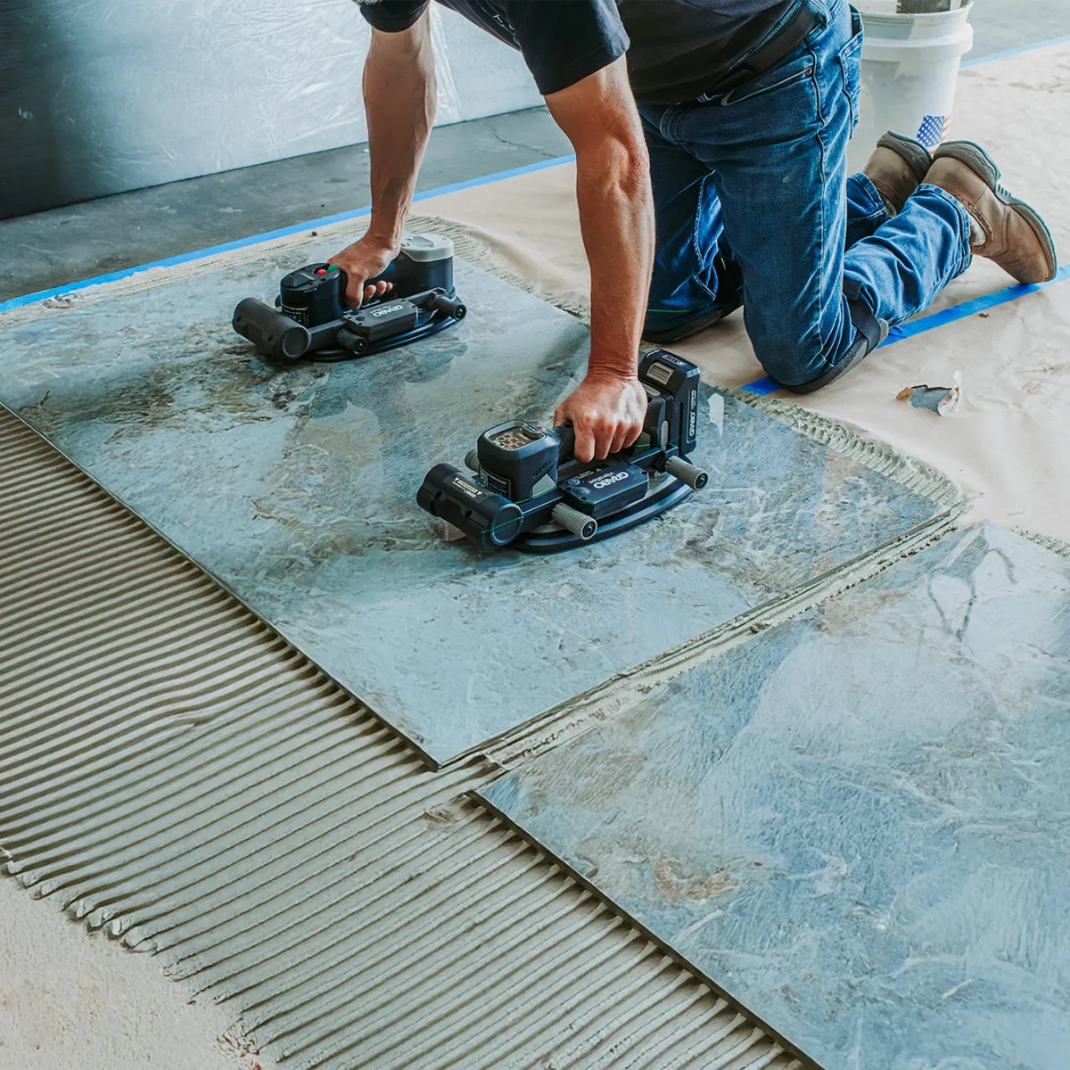 Grabo Tile Vibration Attachment grip the tile, turn on the vibration feature, and allow the attachment to distribute the mortar evenly to ensure optimal adhesion and eliminate trapped air pockets