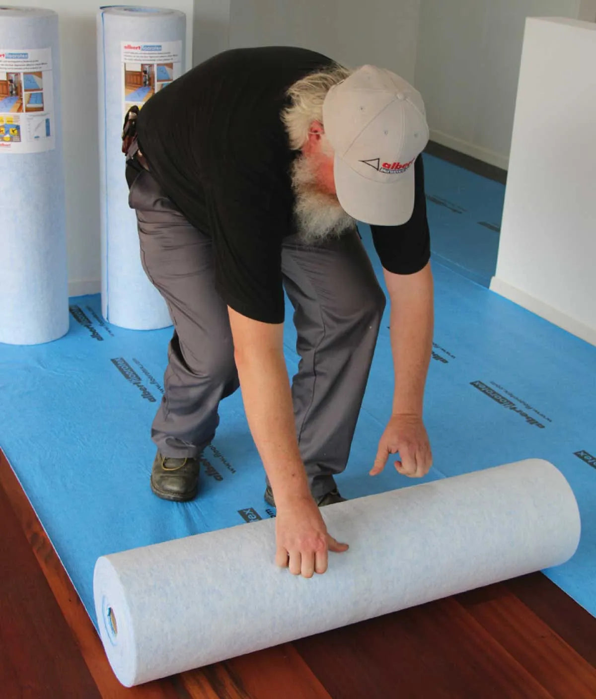 Blue Floorotex Temp Floor Protection Roll for hardwood flooring, showcasing durable, protective material.