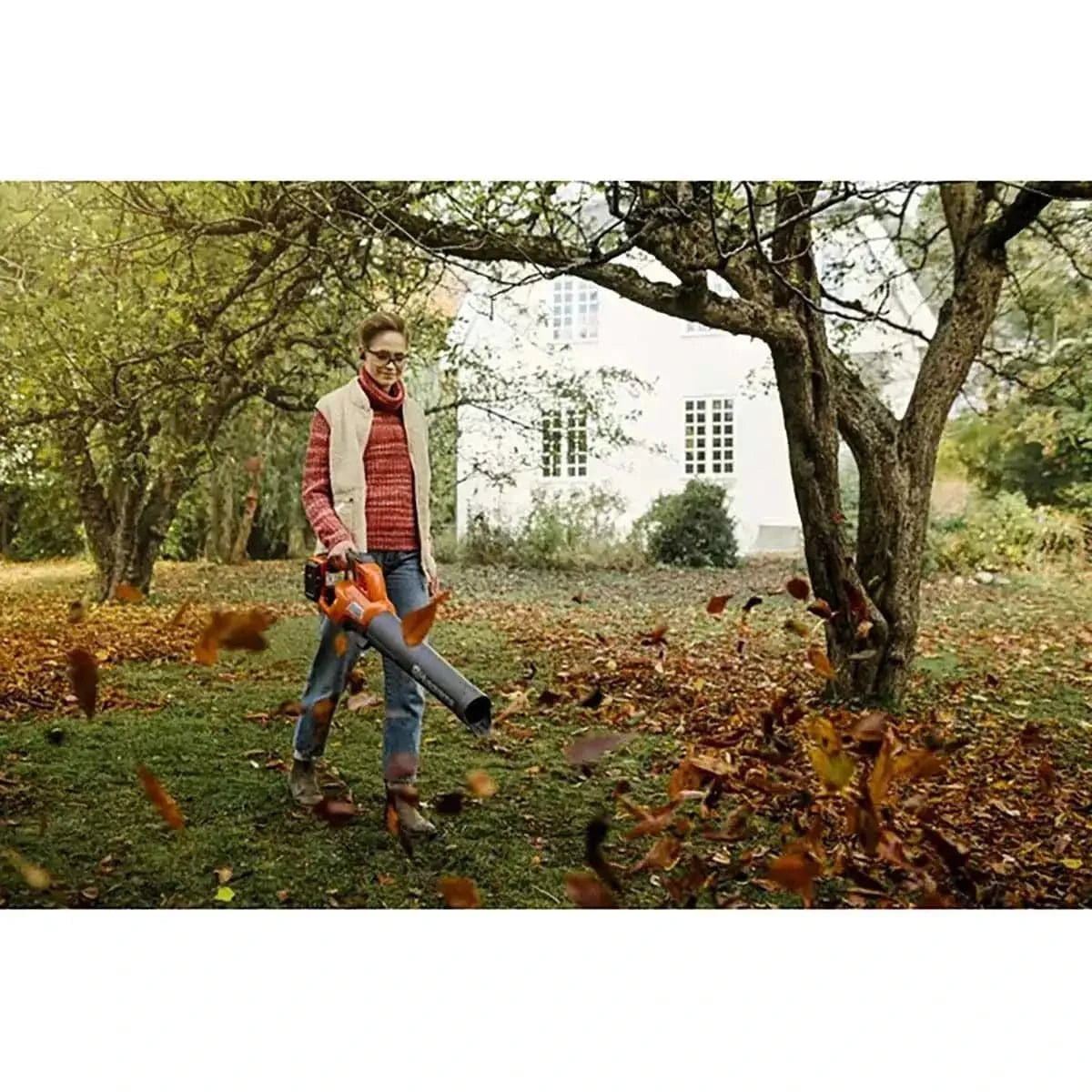 Husqvarna 230iB Leaf Blower with battery and charger in use
