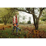 Husqvarna 230iB Leaf Blower with battery and charger in use