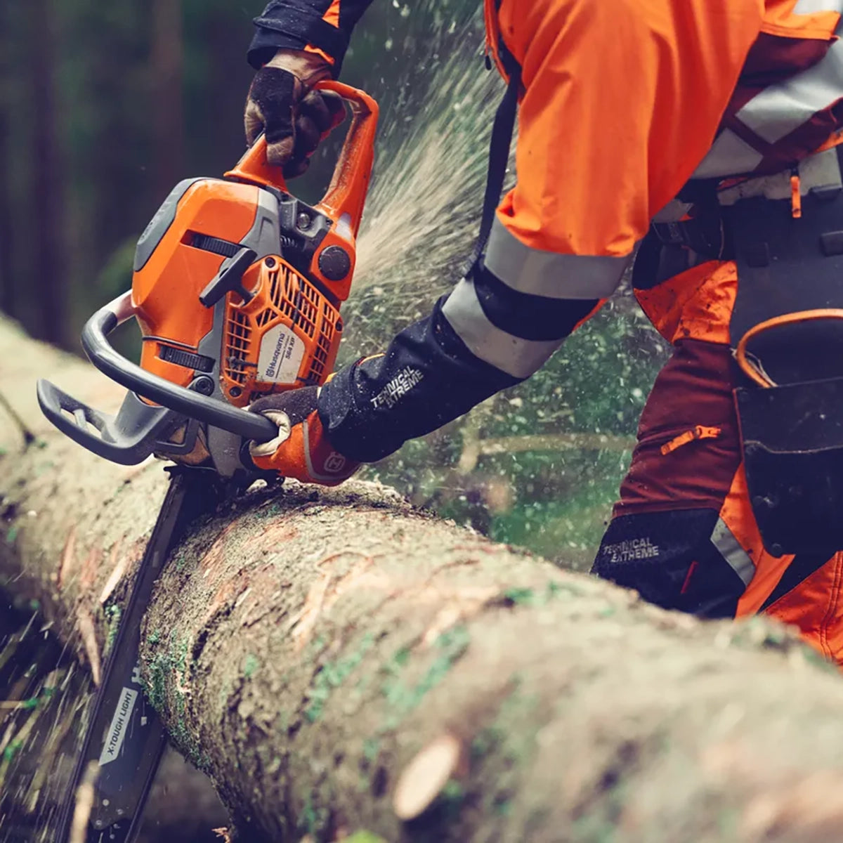 Husqvarna 564 XP G Fuel-Injected Chainsaw In Use