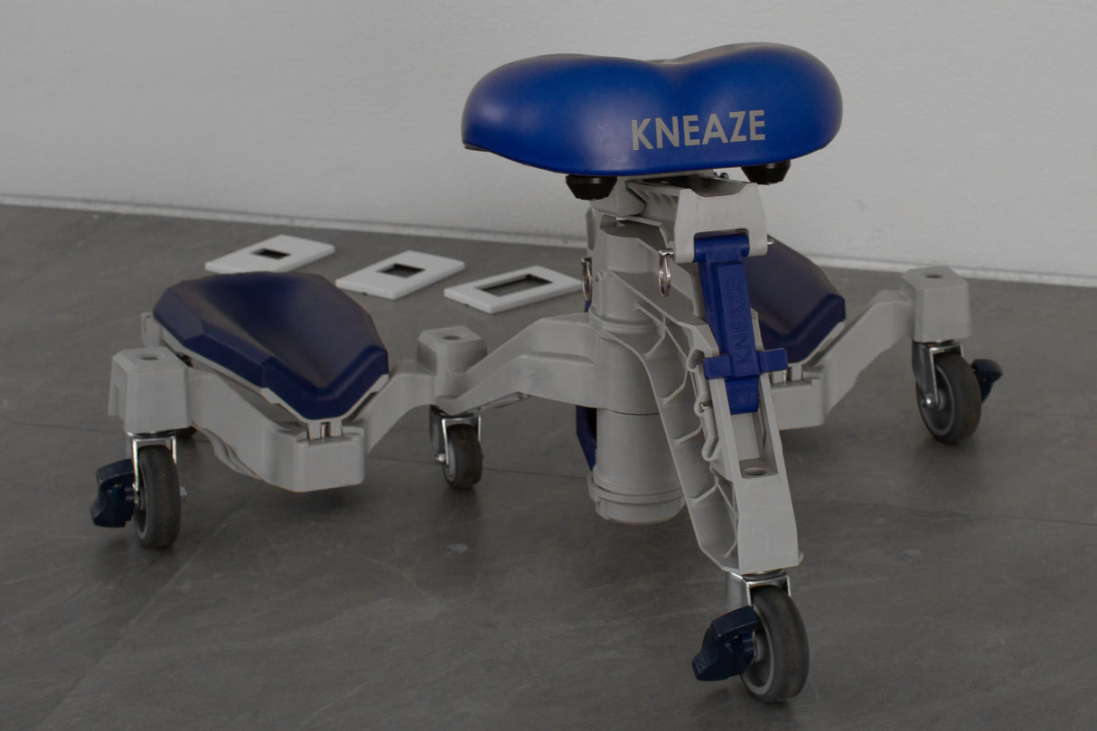 KNEAZE with casters on a gray floor