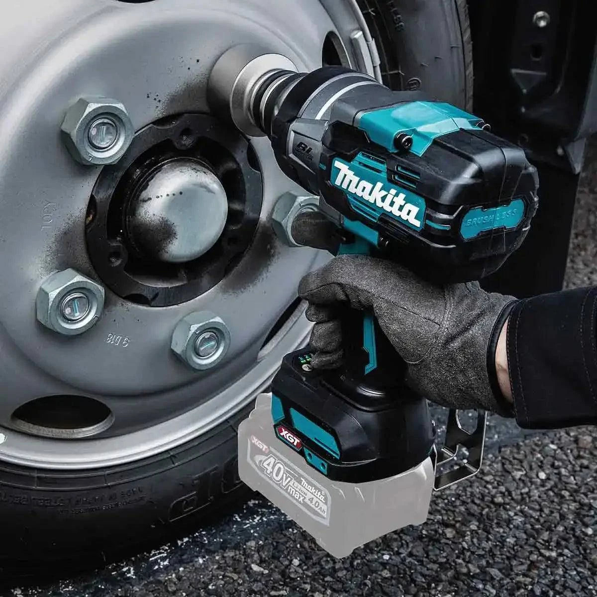Makita 40V max XGT Brushless Cordless Drive Impact Wrench in Use on a car tire