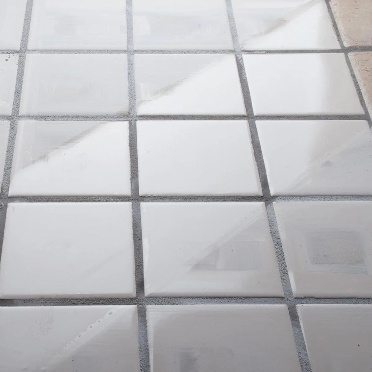 Mapei Cement grout haze remover to professionally clean grout haze left during cement grout installation