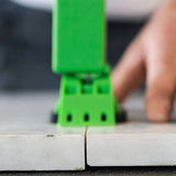 installation removal tool locking cap to engage the re-usable connecting tab and tension MLT System, to create a lippage free surface
