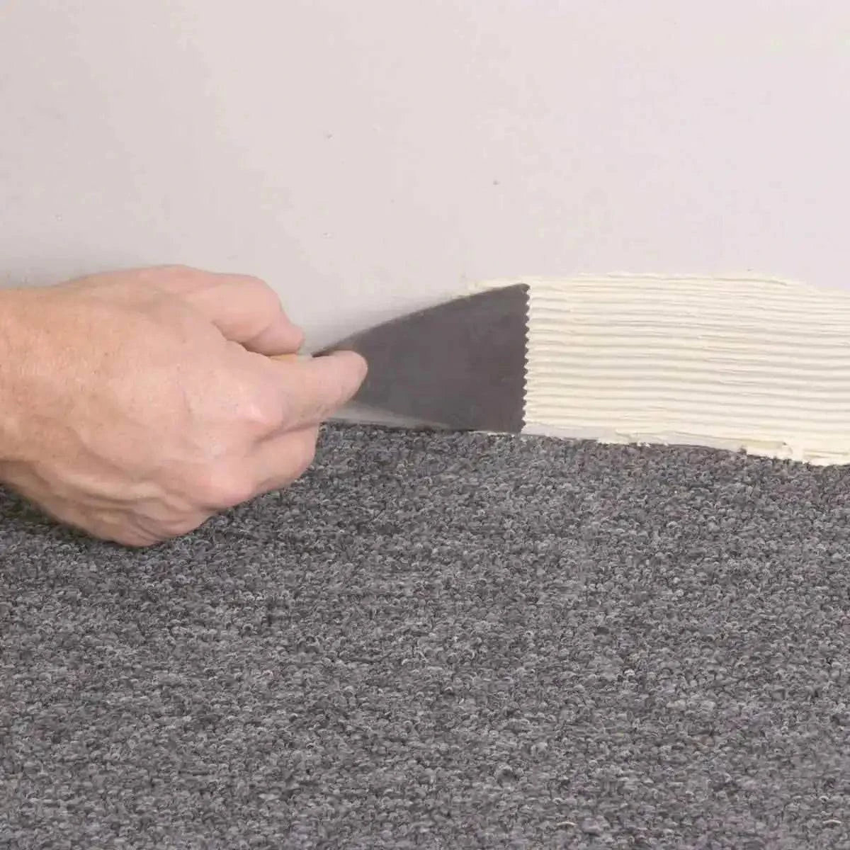 vinyl flooring, sheet vinyl, cove base, vinyl baseboard, adhesive spread tool