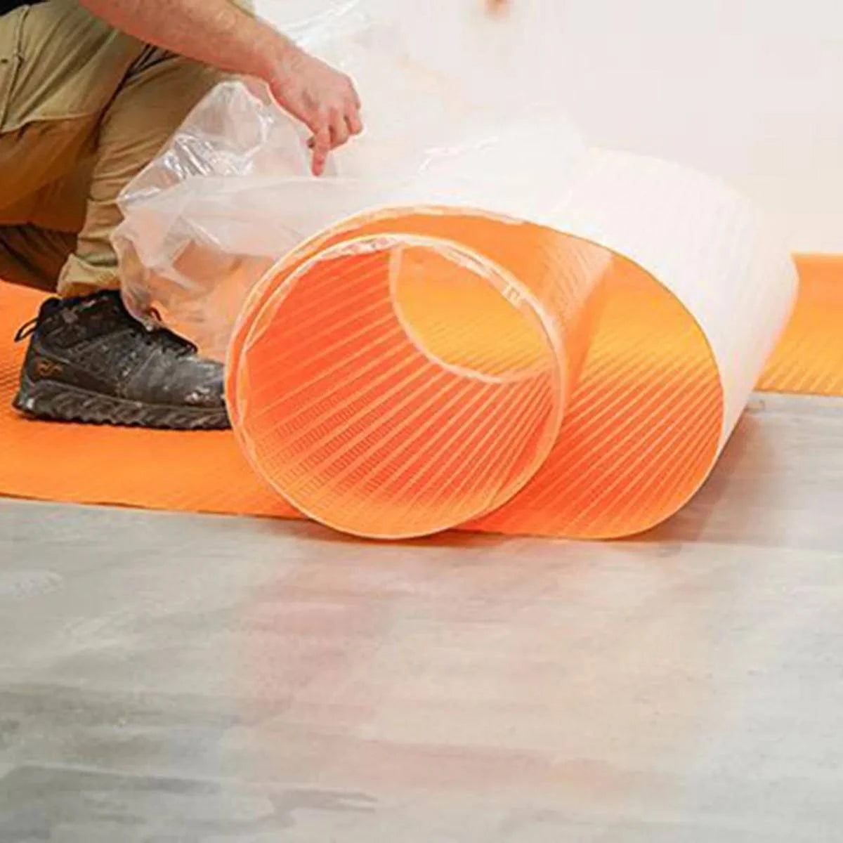 Schluter Ditra-PS Peel and Stick Uncoupling Membrane Roll layout on a substrate