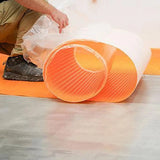 Schluter Ditra-PS Peel and Stick Uncoupling Membrane Roll layout on a substrate