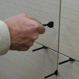 remove the cap and threaded post from the installed tile. Caps can be cleaned and reused