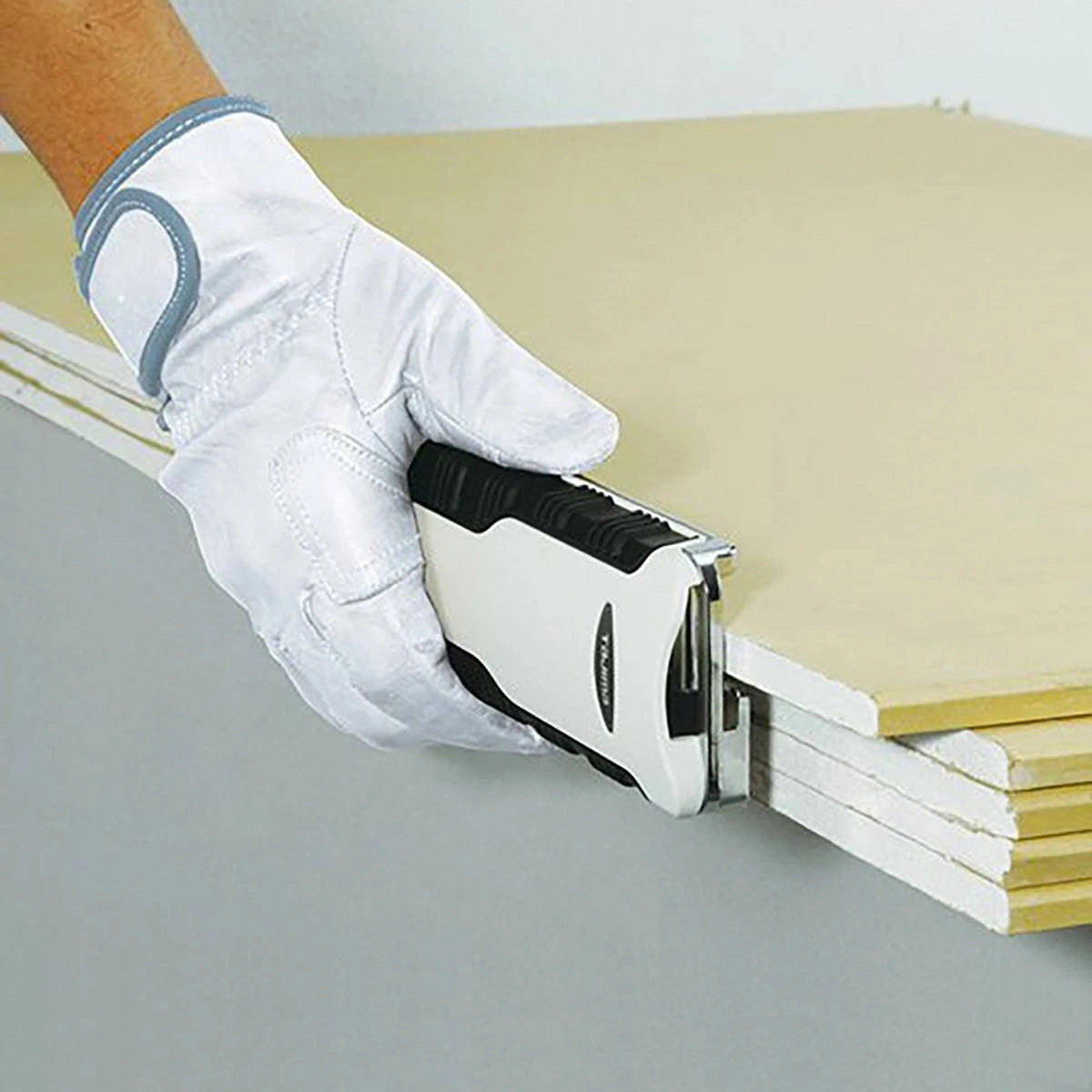 Tajima Combination Drywall Rasp in use